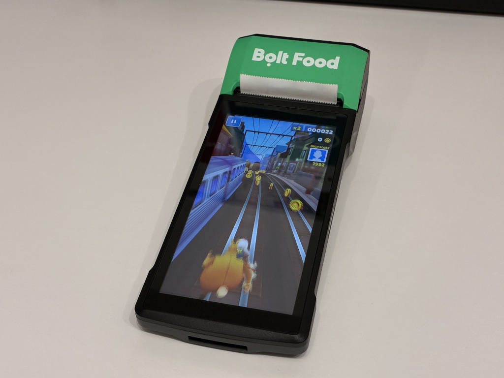 Bolt Food branded POS terminal, playing Subway Surfers